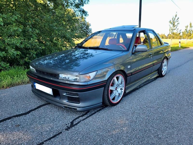 Grau Gebraucht 1990 Mitsubishi Lancer Limousine | 9.900 € - Bild 1/4