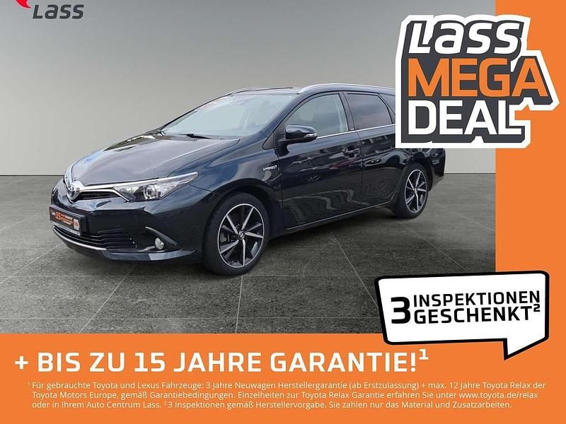 Titaniumblau mica metallic Gebraucht 2017 Toyota Auris Hybrid Basis Kombi | 16.480 € (Fairer Preis) - Bild 1/4