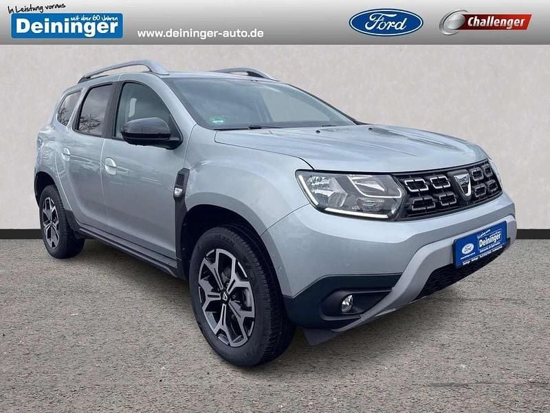 Highland grey Gebraucht 2021 Dacia Duster Celebration SUV | 17.980 € (Fairer Preis) - Bild 1/4