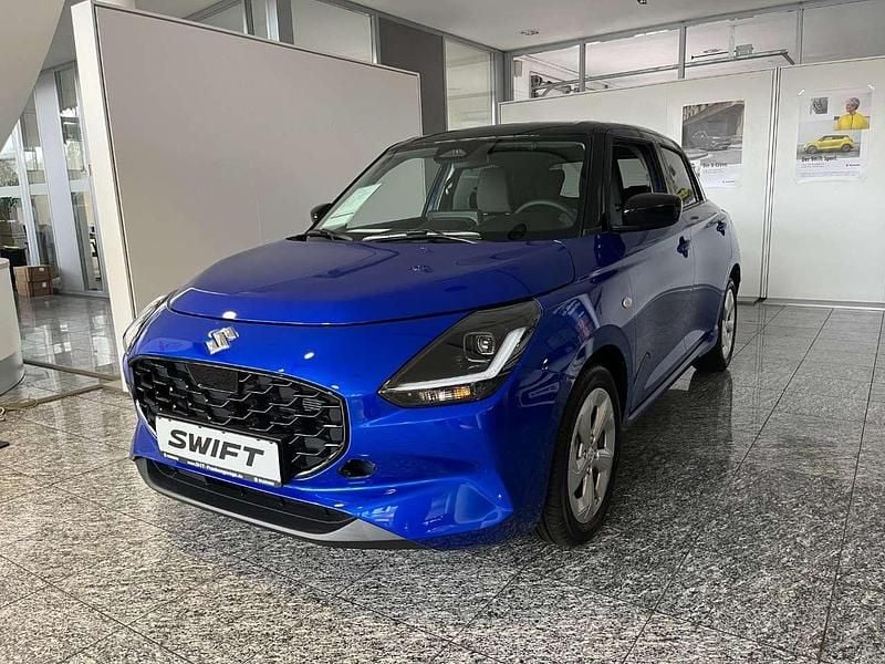 Frontier blue pearl metallic / Neu 2024 Suzuki Swift Comfort Kleinwagen | 16.290 € - Bild 1/4
