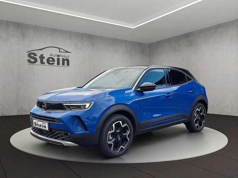 Voltaik blau (metallic) Gebraucht 2024 Opel Mokka-e Ultimate SUV | 29.490 € - Bild 1/4