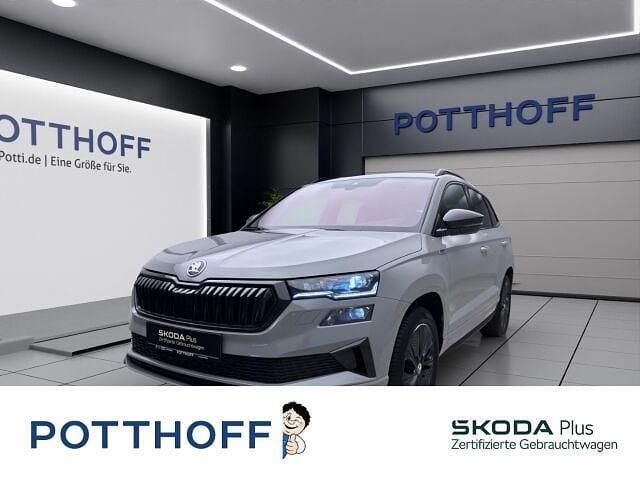 Grau Gebraucht 2024 Skoda Karoq SportLine SUV | 35.777 € (Guter Preis) - Bild 1/4