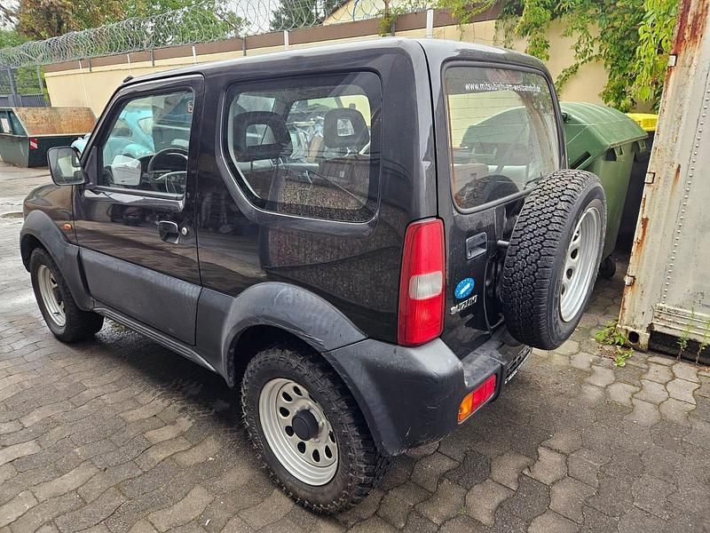Grau Gebraucht 1999 Suzuki Jimny SUV | 3.990 € - Bild 1/4