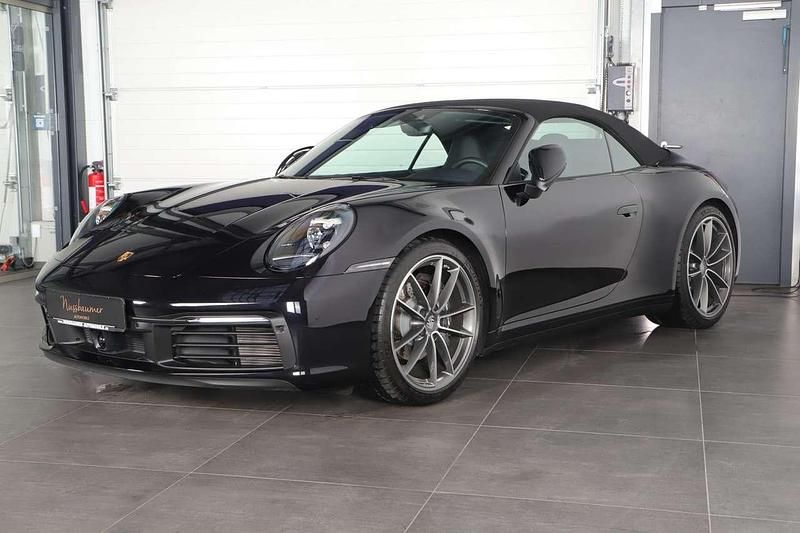 Gebraucht Porsche 911 Carrera Cabriolet 385 PS (283 kW) 2024 Tiefschwarz Cabrio