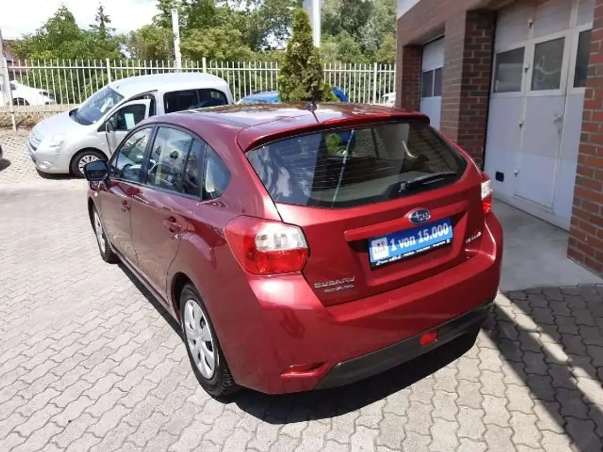 Gebraucht Subaru Impreza 114 PS (83 kW) 2013 Dunkelrot metallic Limousine