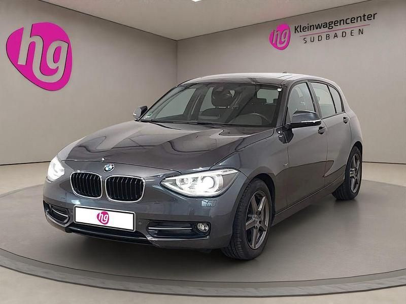 Grau Gebraucht 2011 BMW 116 Sport Line Kleinwagen | 8.990 € (Fairer Preis) - Bild 1/4