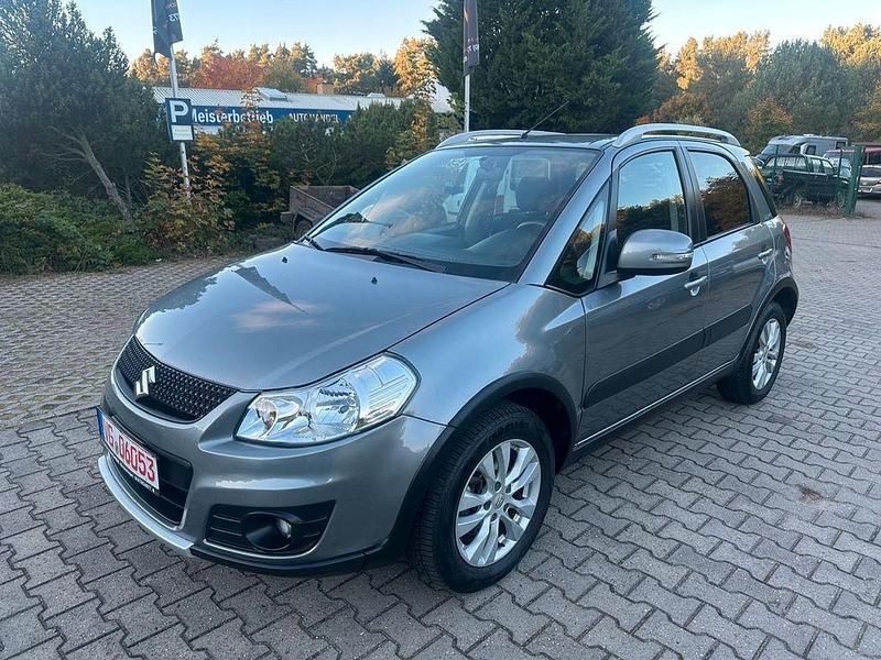 Grau Gebraucht 2013 Suzuki SX4 Style Limousine | 8.290 € (Fairer Preis) - Bild 1/4
