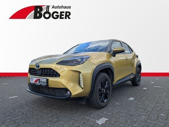 Warm gold metallic Gebraucht 2022 Toyota Yaris Hybrid Elegant | 24.490 € (Fairer Preis) - Bild 1/4