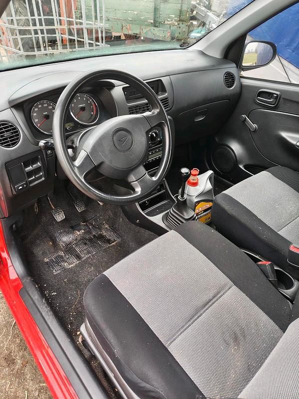 Gebraucht Daihatsu Cuore 50 PS (36 kW) 2005 Rot Kleinwagen