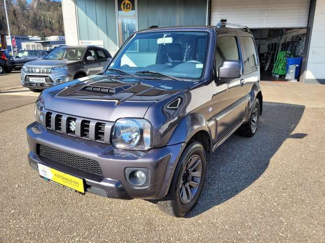 Grau Gebraucht 2015 Suzuki Jimny Comfort SUV | 16.990 € (Teuer) - Bild 1/4