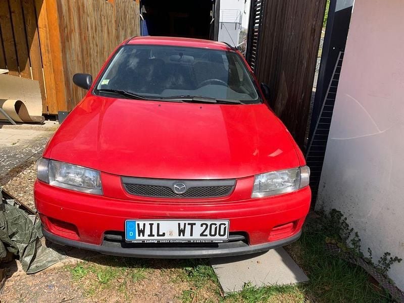 Second-hand Mazda 323 73 CP (53 kW) 1998 Roșu Berlinǎ