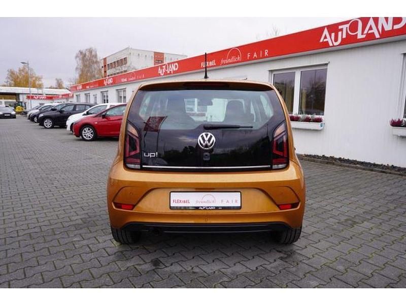 Gebraucht VW up! 90 PS (66 kW) 2018 Honey yellow metallic (metallic) Kleinwagen