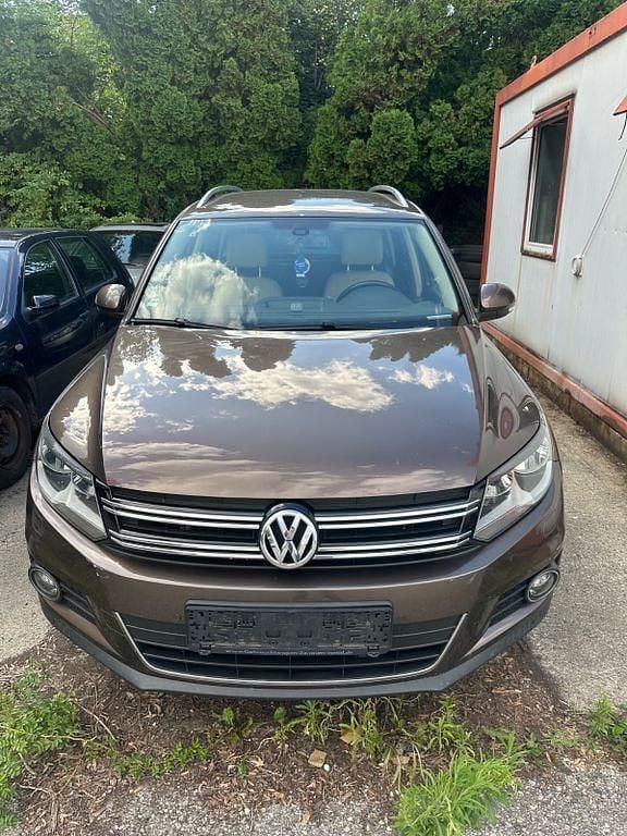 Toffee/graciosabraun Gebraucht 2014 VW Tiguan Sportline SUV | 8.990 € (Superpreis) - Bild 1/4