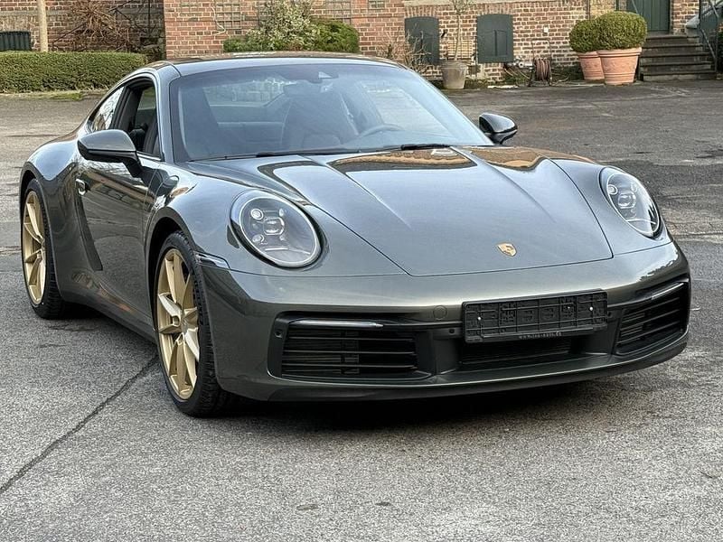 Aventuringrünmetallic Gebraucht 2024 Porsche 911 Carrera Coupé | 119.790 € (Superpreis) - Bild 1/4