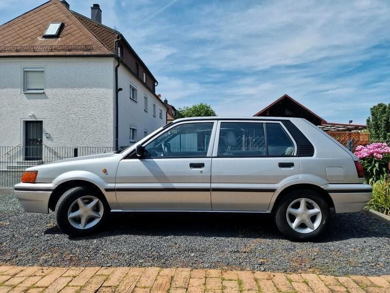 Grau Gebraucht 1990 Nissan Sunny Kleinwagen | 2.500 € - Bild 1/4