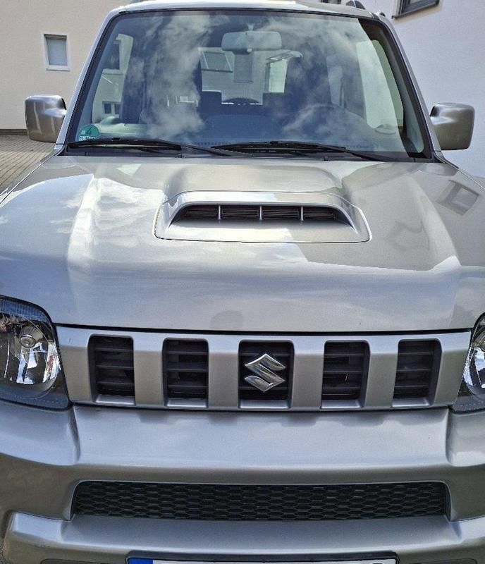 Silber Gebraucht 2015 Suzuki Jimny Style SUV | 15.999 € (Fairer Preis) - Bild 1/4