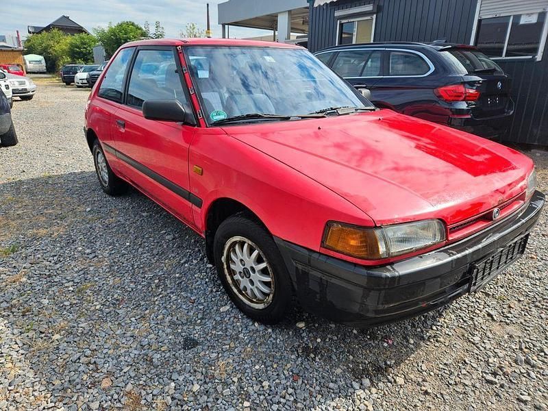 Rot Gebraucht 1994 Mazda 323 Kleinwagen | 1.000 € - Bild 1/4