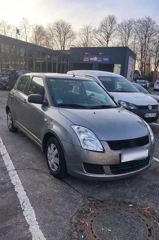 Grau Gebraucht 2009 Suzuki Swift Kleinwagen | 2.000 € (Fairer Preis) - Bild 1/4