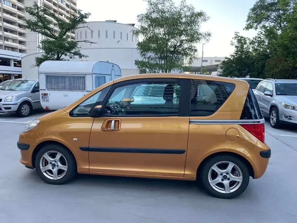Gebraucht Peugeot 1007 109 PS (80 kW) 2006 Gold Van / Kleinbus