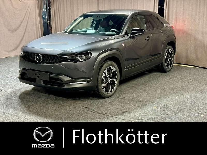 Machine gray Neu 2025 Mazda MX30 Exclusive SUV | 23.790 € (Superpreis) - Bild 1/4