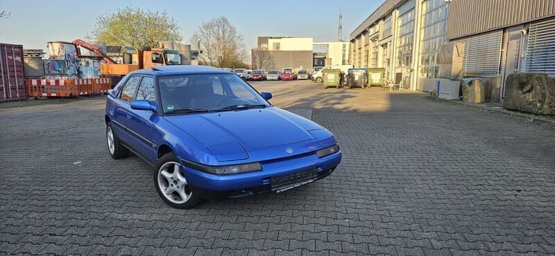 Blau Gebraucht 1993 Mazda 323 Limousine | 3.900 € - Bild 1/4