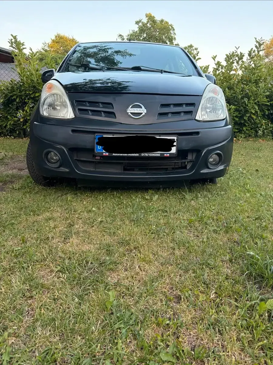 Gebraucht Nissan Pixo 63 PS (46 kW) 2011 Schwarz Kleinwagen