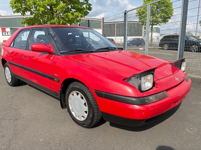 Rot Gebraucht 1994 Mazda 323 Limousine | 3.900 € - Bild 1/4