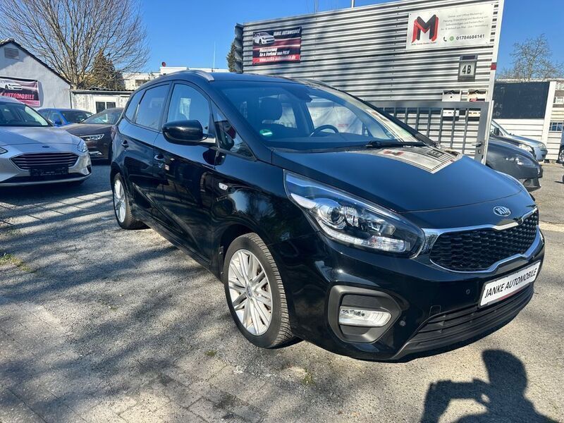 Cassisschwarz met. Gebraucht 2019 Kia Carens DREAM-TEAM Edition Van / Kleinbus | 14.999 € (Fairer Preis) - Bild 1/4