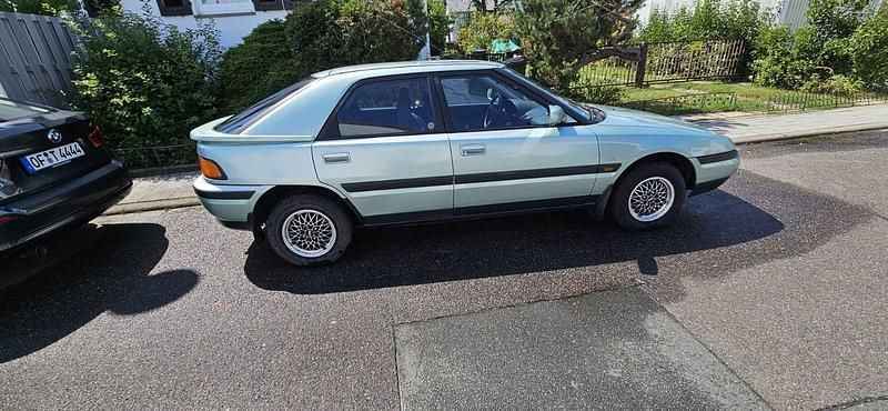 Gebraucht Mazda 323 98 PS (72 kW) 1992 Grün Kleinwagen