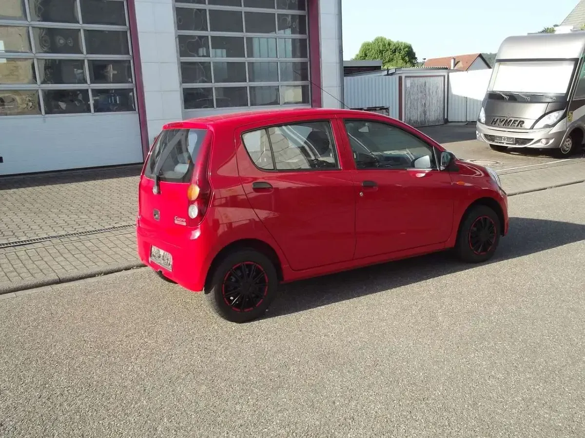 Gebraucht Daihatsu Cuore 69 PS (50 kW) 2008 Rot Kleinwagen