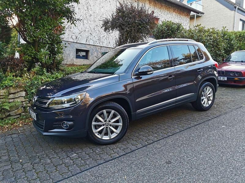 Grau Gebraucht 2014 VW Tiguan LOUNGE SUV | 10.499 € (Fairer Preis) - Bild 1/4