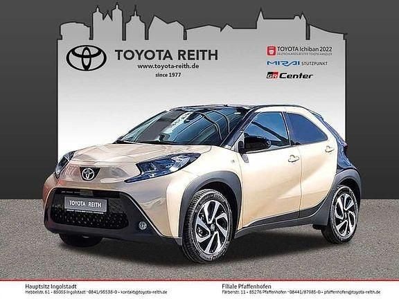 Ginger beige metallic/ night sky black Gebraucht 2024 Toyota Aygo X Basis SUV | 17.320 € (Fairer Preis) - Bild 1/4