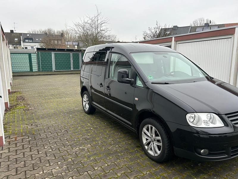 Gebraucht VW Caddy Team 105 PS (77 kW) 2010 Schwarz Van / Kleinbus