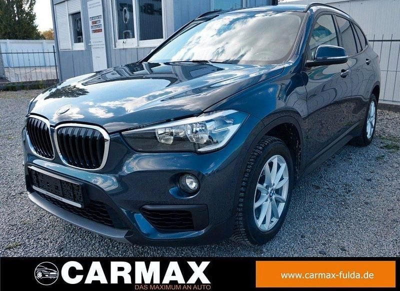 Atlantikgrau (metallic) Gebraucht 2017 BMW X1 Advantage SUV | 17.900 € (Guter Preis) - Bild 1/4