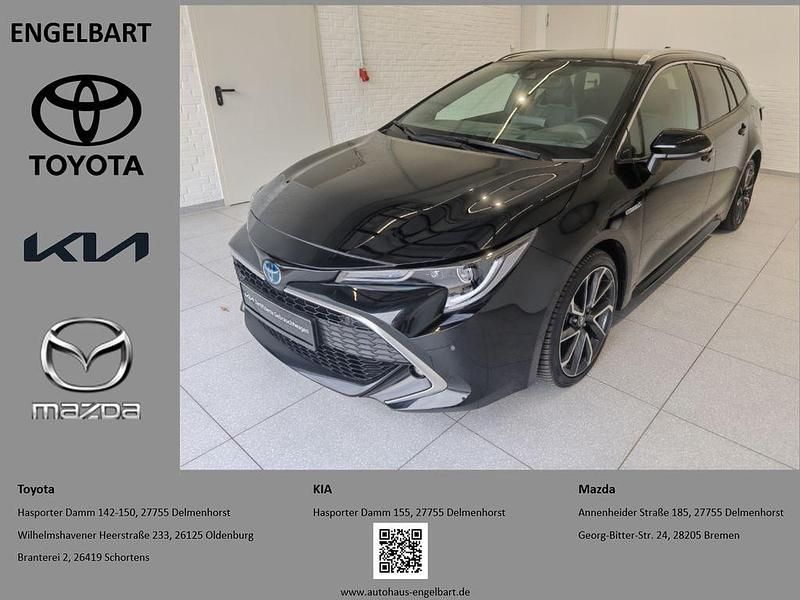Black mica / ink Gebraucht 2021 Toyota Corolla Lounge Kombi | 26.490 € (Fairer Preis) - Bild 1/4