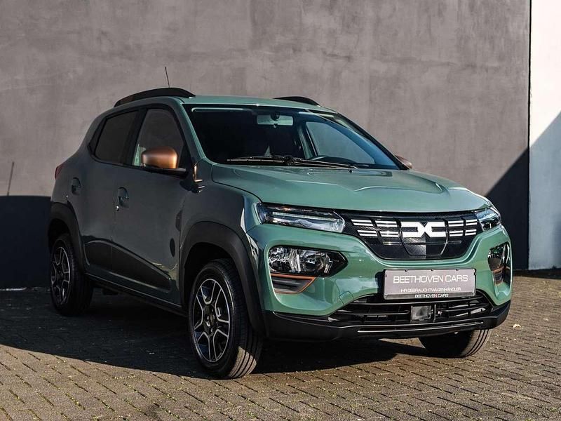 Gebraucht Dacia Spring Extreme 47 kW (65 PS) 2023 Oliv grau Kleinwagen