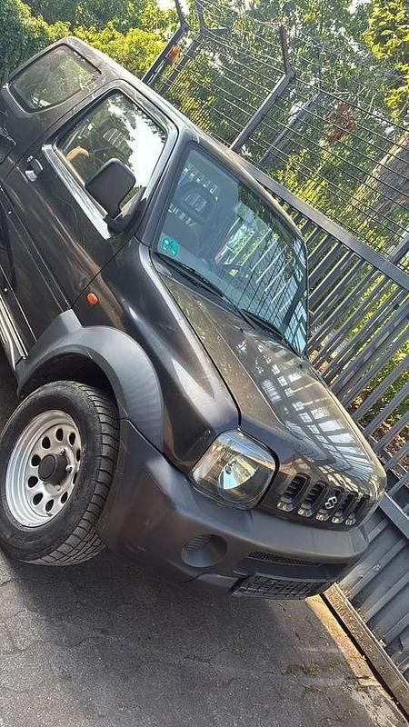 Schwarz Gebraucht 1999 Suzuki Jimny SUV | 3.900 € - Bild 1/4
