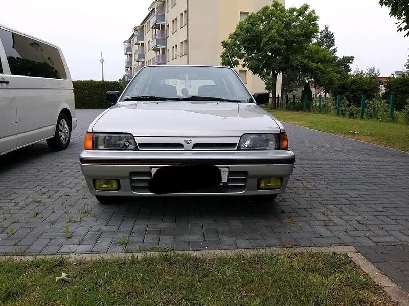 Silber Gebraucht 1990 Nissan Sunny Kleinwagen | 2.500 € - Bild 1/4