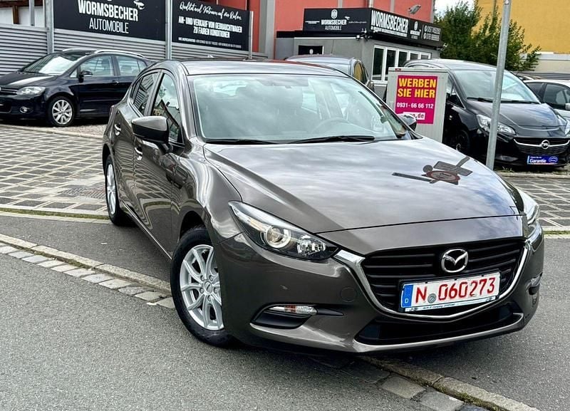 Titanium flash Gebraucht 2017 Mazda 3 Prime-Line Limousine | 11.200 € (Guter Preis) - Bild 1/4