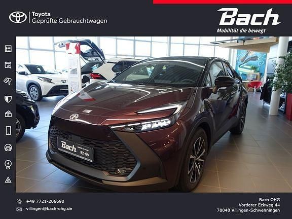 Dunkel amethyst/schwarz Gebraucht 2024 Toyota C-HR Team SUV | 36.090 € - Bild 1/4