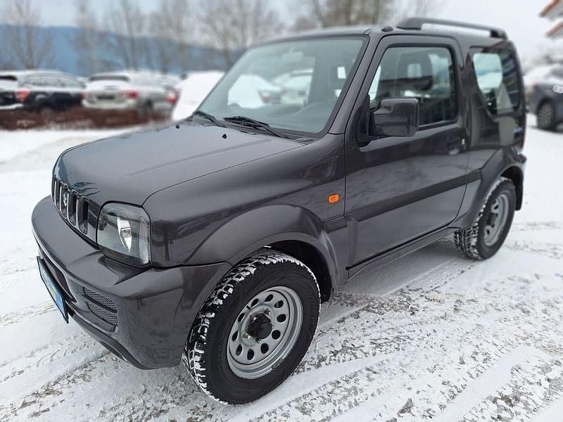 Quasar grey Gebraucht 2012 Suzuki Jimny Club SUV | 9.900 € (Fairer Preis) - Bild 1/4