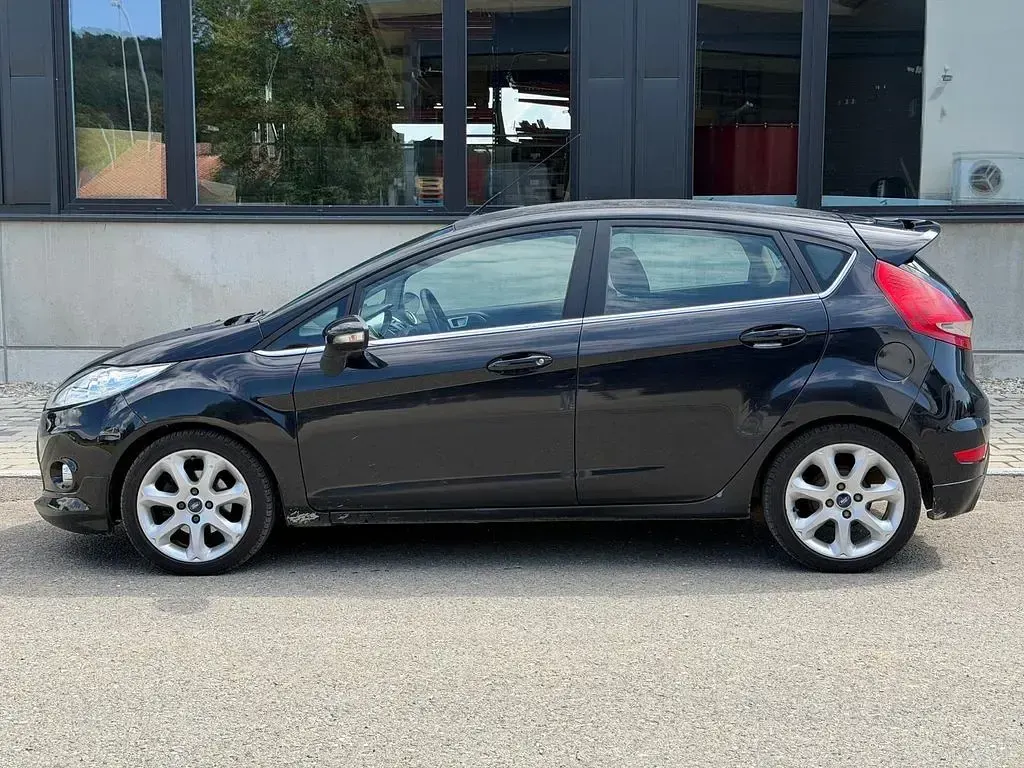 Gebraucht Ford Fiesta Titanium 95 PS (69 kW) 2011 Pantherschwarz metallic Limousine