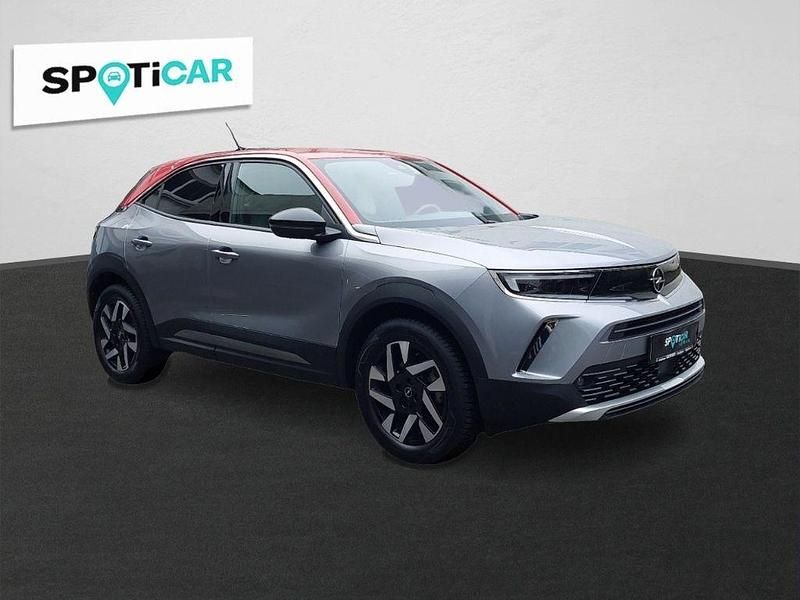 Gebraucht Opel Mokka-e Elegance 100 kW (136 PS) 2022 Kontrast grau/quarz silber SUV