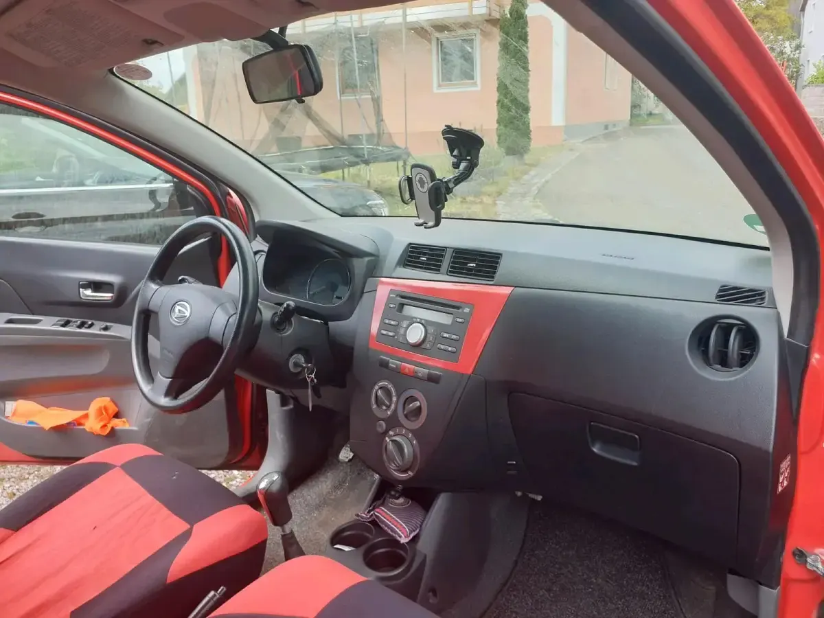 Gebraucht Daihatsu Cuore 69 PS (50 kW) 2008 Rot Kleinwagen