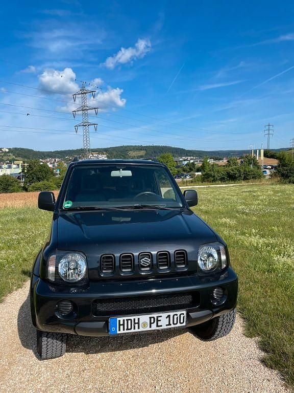 Schwarz Gebraucht 2005 Suzuki Jimny Comfort SUV | 6.900 € (Fairer Preis) - Bild 1/4