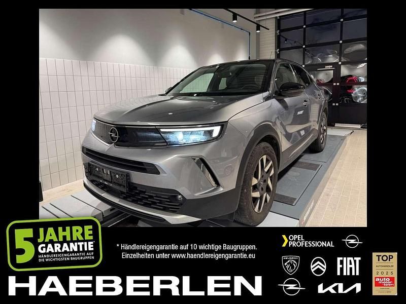 Quarz silber Gebraucht 2022 Opel Mokka-e Elegance SUV | 15.980 € (Fairer Preis) - Bild 1/4