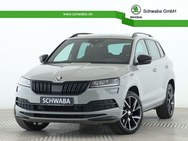 Stahlgrau Gebraucht 2021 Skoda Karoq SportLine SUV | 31.890 € (Teuer) - Bild 1/4