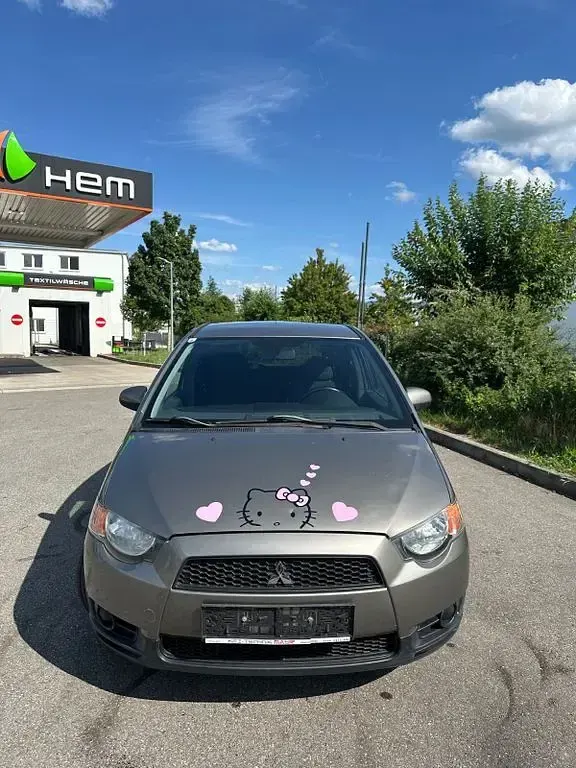 Gebraucht Mitsubishi Colt Inform 75 PS (55 kW) 2013 Braun Limousine