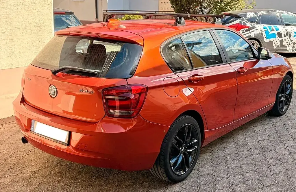 Gebraucht BMW 114 95 PS (69 kW) 2013 Orange Kleinwagen