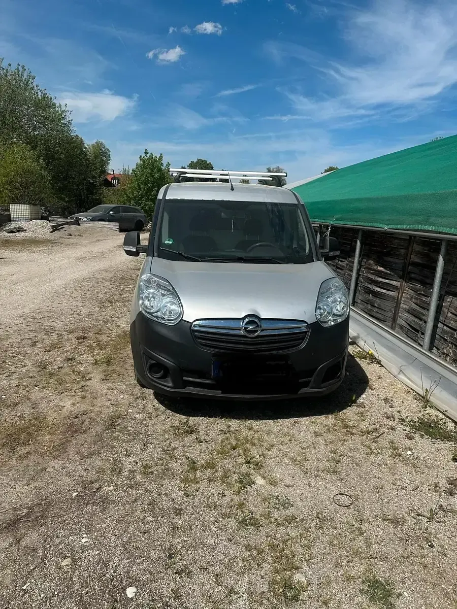 Używany Opel Combo 90 KM (66 kW) 2014 Srebrny Minivan